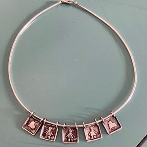 Silpada necklace with 3 girl pendants and two heart pendants